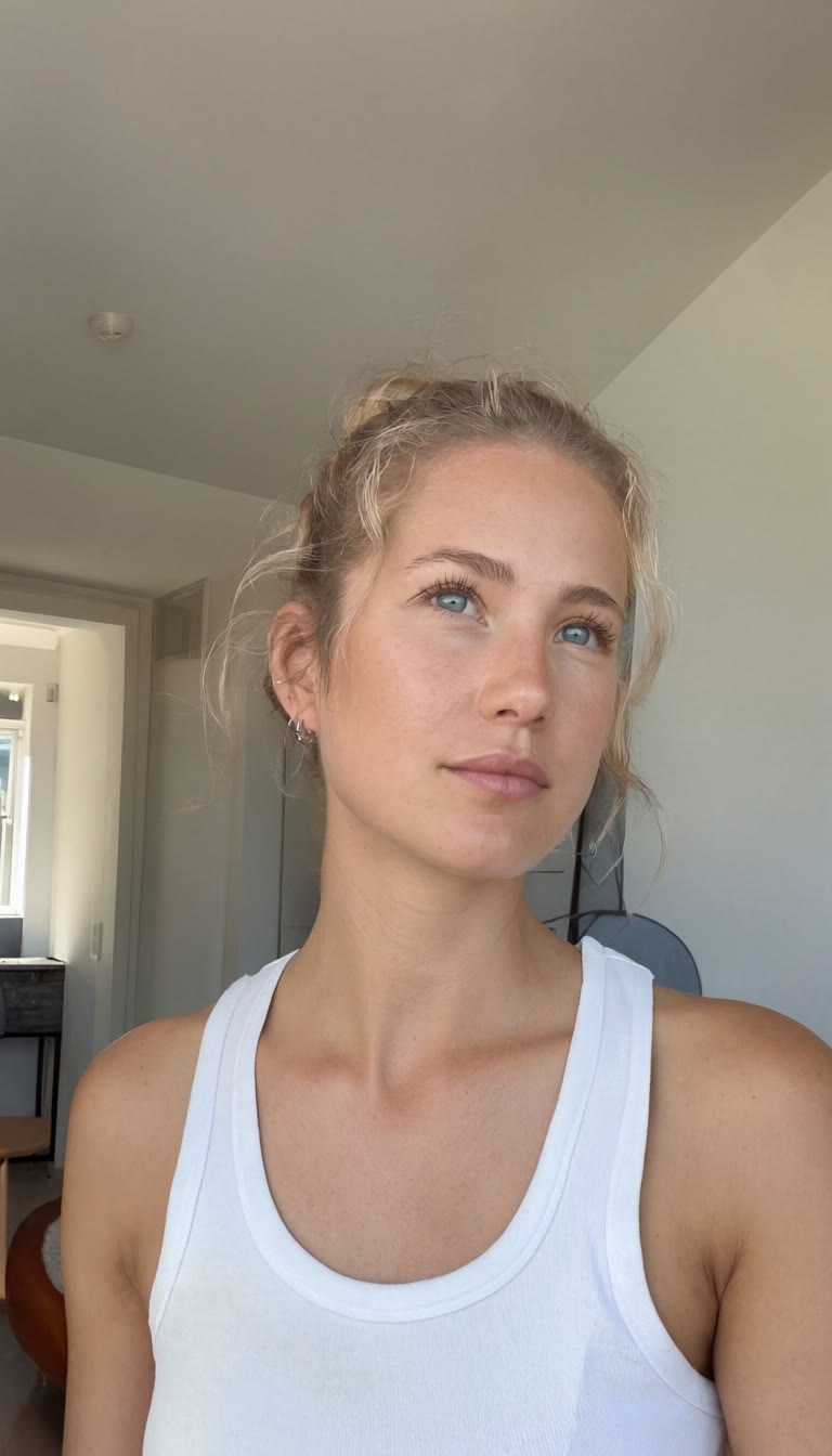 A generated presenter: a young woman in a white tank top, in a bright flat